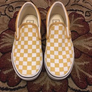 “Vans” checkerboard slip-ons.